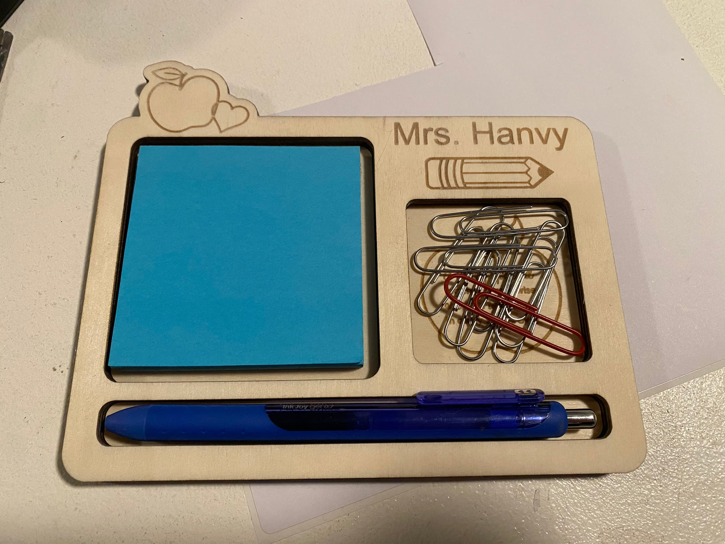 Post it not holder with pen and paper clips